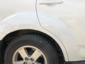 wheel and door damage repaired - after